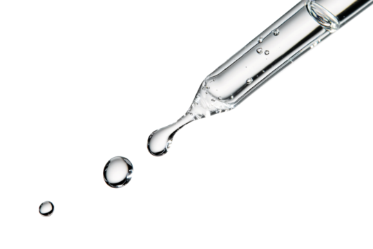 Close up clear dropper releasing liquid drops with reflections isolated on background.