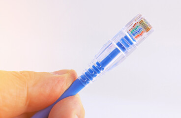 Obraz premium Rj45 connector for connecting a twisted pair cable. Data transmission over Ethernet.