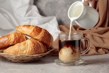 Croissants and coffee with cream.