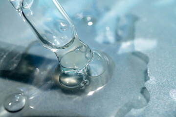 pipette with a drop of facial serum