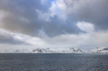 Scenic cold winter landscape of Flakstad beach in Lofoten Archipelago, Norway, Europe