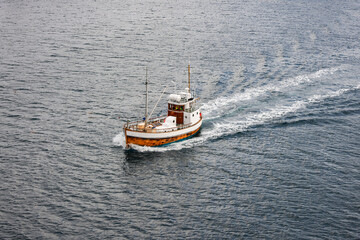 Ship fishing boat near Hamnoy fishing village in Lofoten Islands, Norway, Europe