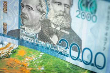 Dominican Republic money, 2000 Dominican pesos banknote against the background of the world,...