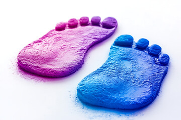 Colorful footprints in pink and blue, suggesting creativity and playfulness.