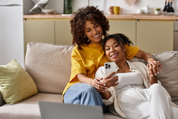 Loving couple enjoys a relaxed day on the couch, sharing smiles and laughter while connecting.