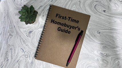 Concept of First Time Homebuyers Guide write on book isolated on Wooden Table.