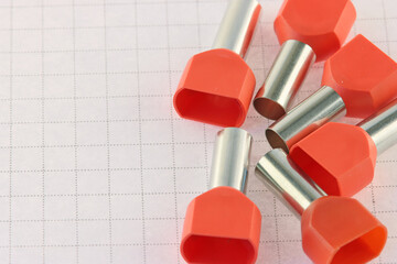 Copper pin colored insulated tips. Close-up. Soft focus.