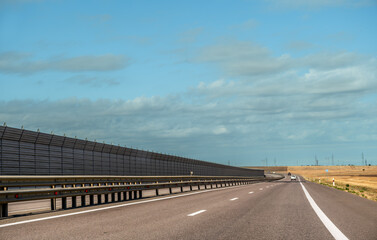 Fototapeta premium A highway with a sound barrier.
