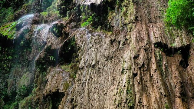 Aerial drone view Tumalog waterfall in a mountain gorge in the tropical jungle of the Philippines, Cebu. High quality 4k footage
