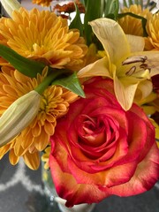 bouquet of orange roses and yellow mums