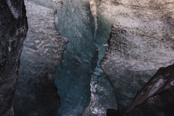 View on cracked ice in ice cave, Southern Iceland. Blue pattern, texture