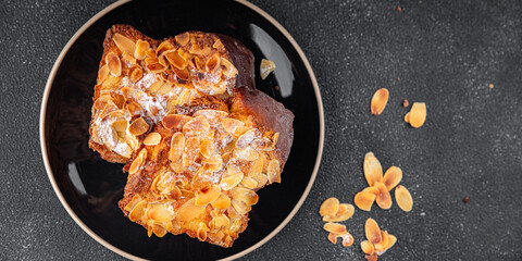 Brioche sweet almond french toast fresh tasty food dish delicious gourmet food background on the table rustic food top view copy space
