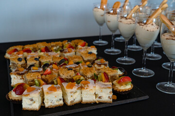 slice of cakes Catering buffet with different food snacks and appetizers. Food styling and restaurant meal serving concept