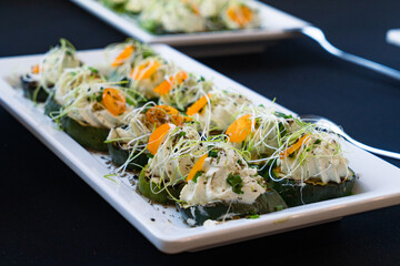 catering sushi rolls with zucchini, cheese and microgreens