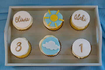 Cupcakes decorated with buttercream frosting on a buffet table