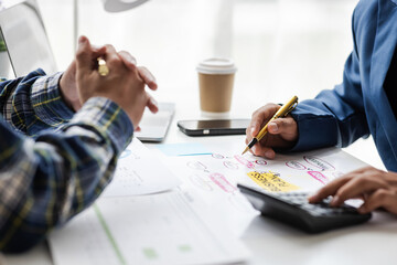 Fototapeta premium Businessman meeting with financial advisor, discussing analysis of financial charts in business report and planning company budget.