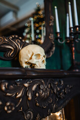 Plastic decorative skull on the fireplace or shelves, Halloween decor