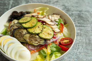 Zucchini and mushroom vegetable salad in a bowl	