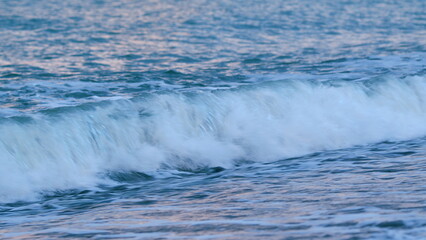Fototapeta premium Dawn Sky Over Serene Ocean Surf. Sunlight Reflect On Water Surface. Calm Marine Scenery. Static view.