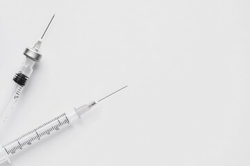 Two Sterile Syringes with Needles on White Background, Medical Equipment Concept