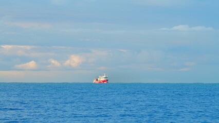Fishing Ship In Open Sea Water. Beautiful Fishing Boat With The Blue Sea On Background. Static View.