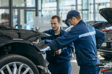 Auto mechanic in a car repair shop