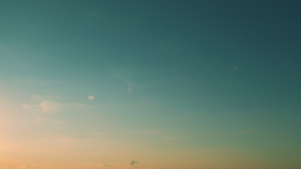 Sunset or dawn backlit by warm sun. Panorama style background. Sunset or dawn sky.