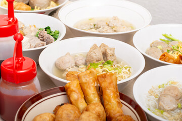 Bakso sapi, Various beef meatballs with accompaniments on wooden table. Most popular Indonesian foods