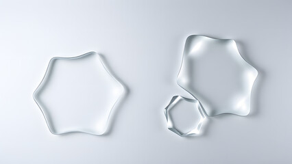 Elegant frosted glass shapes with beveled edges, layered over a metallic gradient of steel gray and silver