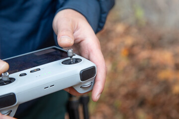 Caucasian man using drone controller.
