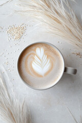 White Creamy Latte Coffee in Ceramic Bowl with Pampas Grass in Minimalist Aesthetic