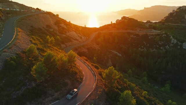 Aerial view of the picturesque Route de Crete near Cassis at sunset, France