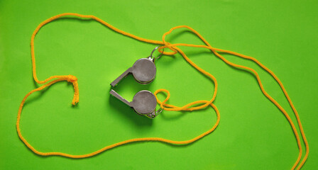 Metal whistle of a referee or trainer.