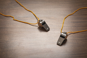 Metal whistle of a referee or trainer.