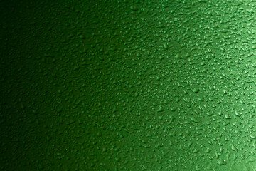Close-up of water drops. Raindrops, on the surface of a car. Gradient from dark to light.  Set it up as a cool background.  Dimensional, wallpaper.