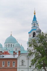  Valaam Island, Russia, July 12, 2024. Bell tower and temple behind the monastery wall.                             