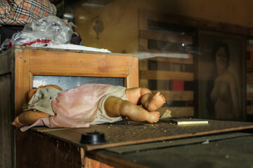 Abandoned Vintage Doll in Dimly Lit Room