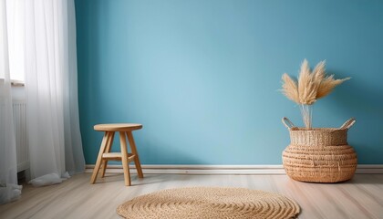 Fototapeta premium Empty Light Blue Wall Mockup in Scandinavian Interior with Wicker Basket and a Light Wooden Stool. Natural Daylight From a Window. Promotion Background.