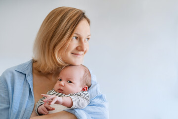 Mother and baby. Loving mom with her little one month old child