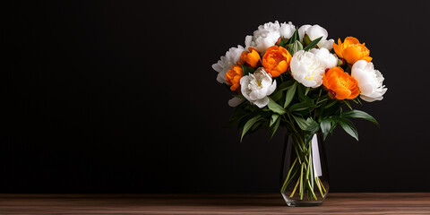 Fototapeta premium A vibrant bouquet of multicolored peonies in full bloom, arranged elegantly in a glass vase on a rustic wooden table