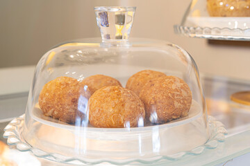 Close-up of Cheese Breads on the cafeteria showcase. Brazilian snack.