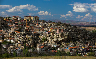 Naklejka premium Cappadocia is a semi-desert region in central Turkey. It is famous for its fairy chimneys - tall cone-shaped rock formations, which are especially numerous in Pasabag Monks Valley and Goreme Valley.