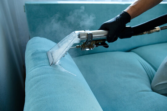 Cleaning concept. Virus prevention sanitizing inside. Process of deep furniture cleaning. Professionally chemical cleaning.
