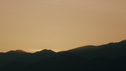 Picturesque Landscape. Sunrise With Sun Rays On Mountain. Sun Sunrise From Behind Mountains.