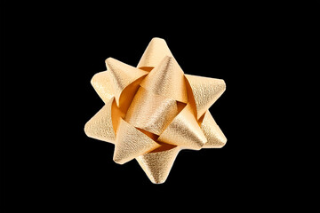 Golden shiny rounded gift bow with texturized laces