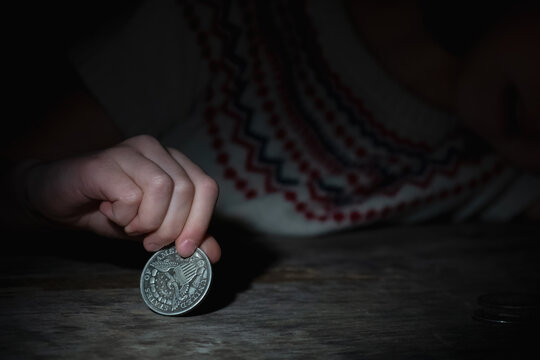 Crown of thorns and rosary beads on brown texture background with space for text