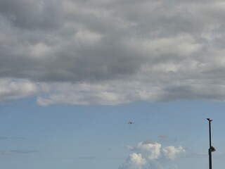 Sky with Cumulus Clouds Over Grassland and Road
