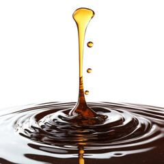 Golden syrup droplets creating ripples on dark, glossy surface, white isolated background.