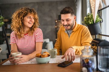 Happy couple have breakfast and cup of coffee at home morning routine