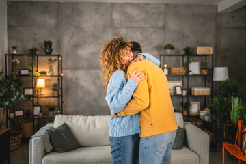 couple girlfriend and boyfriend in love dance and hug at home have fun